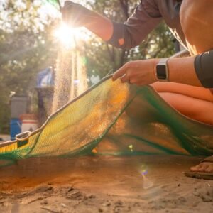 sand falling through the sand free mat perfect for rafting trips at camp.